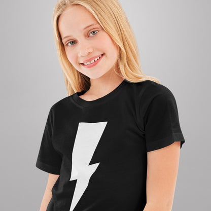 Young girl wearing a black t-shirt with a white lightning bolt design on a gray background
